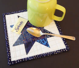 handmade quilted patchwork star mug rug, coffee mug rug, coffee mug coaster