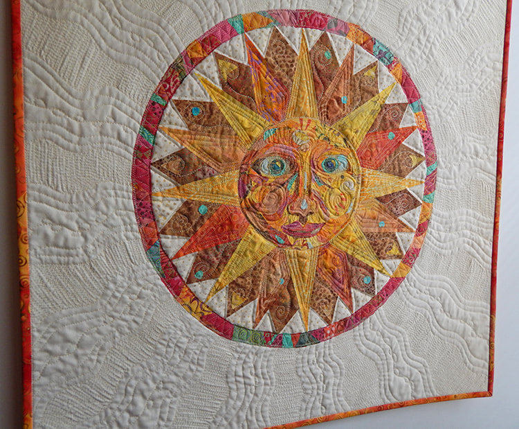 Sun man art quilt wall hanging handmade fabric collage north carolina