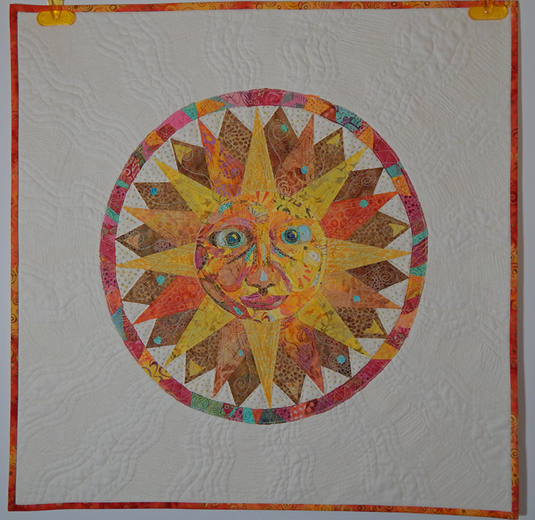 sun man fabric collage quilt art quilt